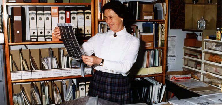 Jill Betts looking at slides.