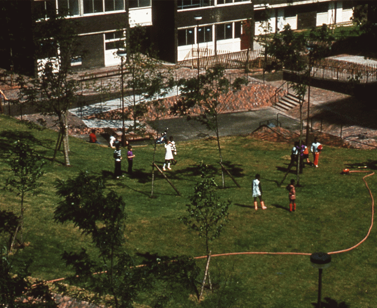 A playground of grass, children and playground furniture, for the Landscape Institute conference on play