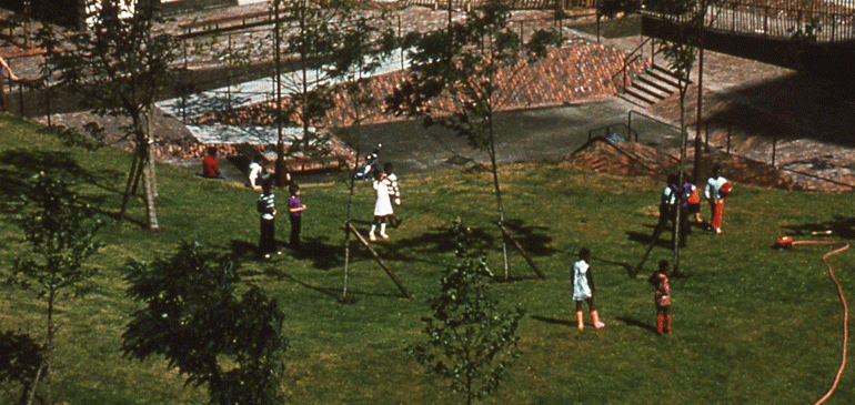 A playground of grass, children and playground furniture, for the Landscape Institute conference on play