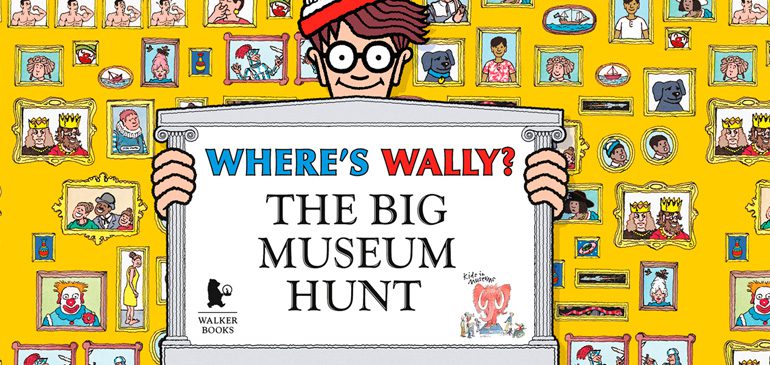 Wally holding up a sign saying Where's Wally? The Big Museum Hunt