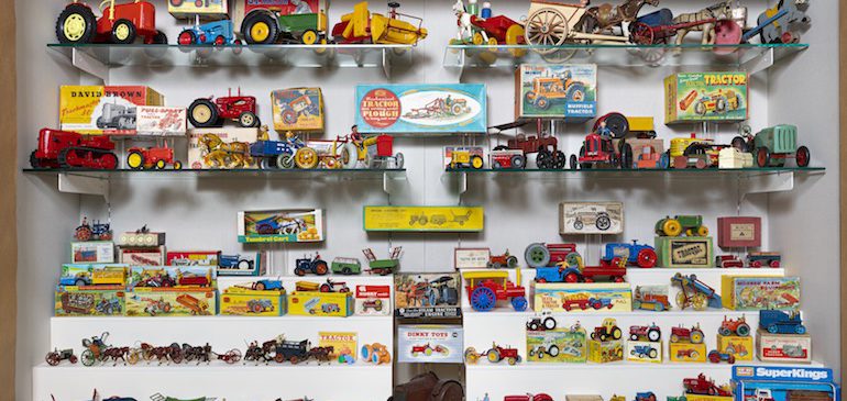 playing at farming exhibition case of farm toys