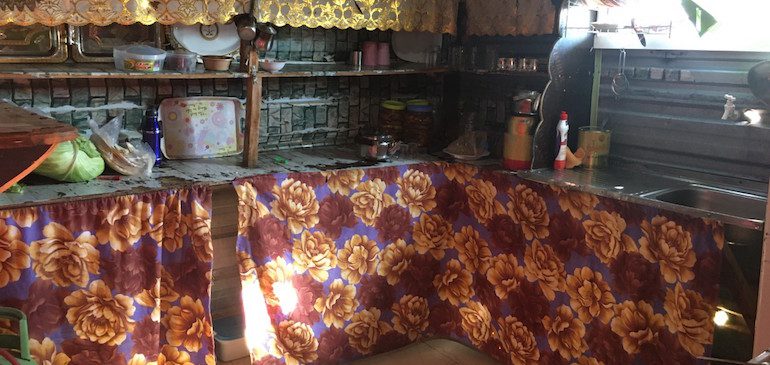 A makeshift kitchen in a refugee caravan in the Zaatari refugee camp, 2019. Photo by Yasmine Shamma