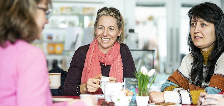 Three women having Hot Drinks in the MERL Cafe