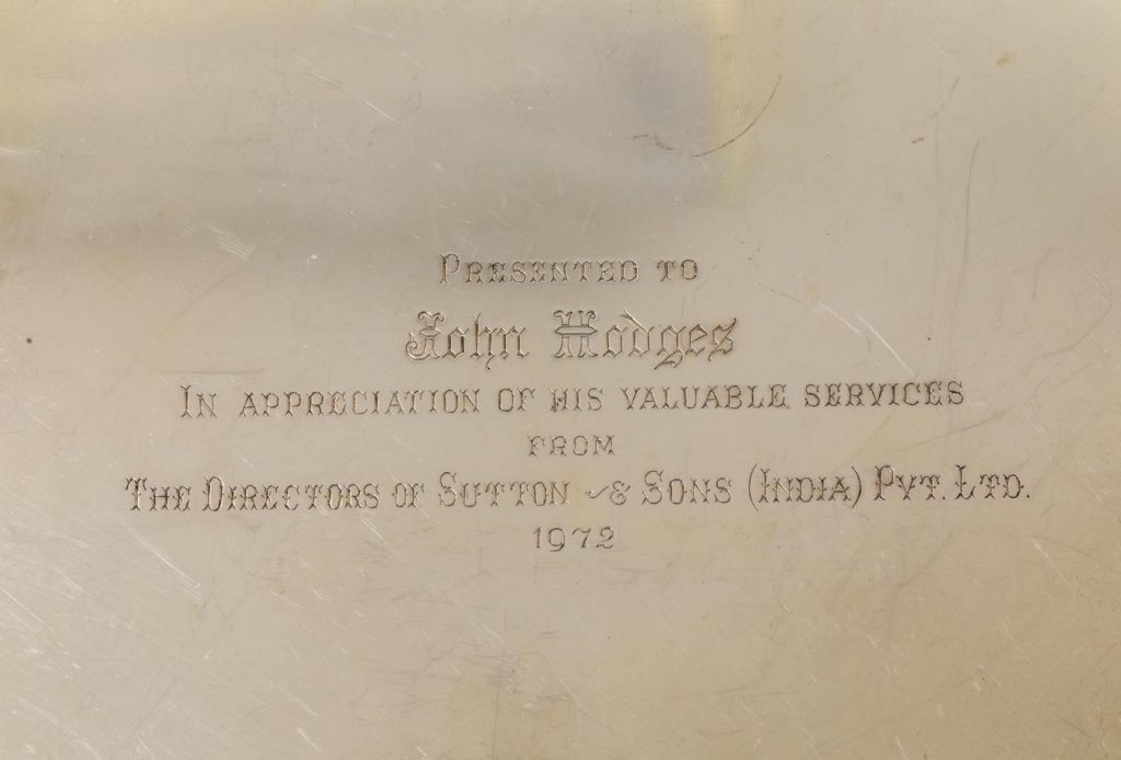 Engraved text on a silvered surface reading 'Presented to John Hodges...'