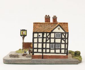 Side view of small ceramic model of mock Tudor public house