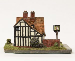 Side view of small ceramic model of mock Tudor public house