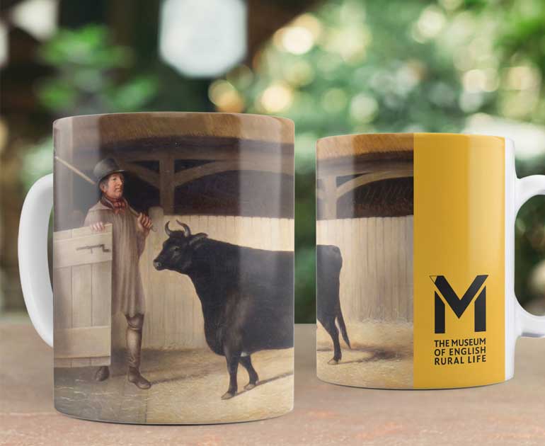 painting of a black cow featured on a mug with a MERL logo