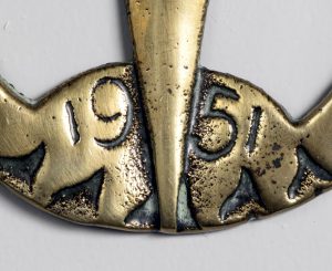 Detail of Armac Brassworks, Festival of Britain horse brass showing date '1951'