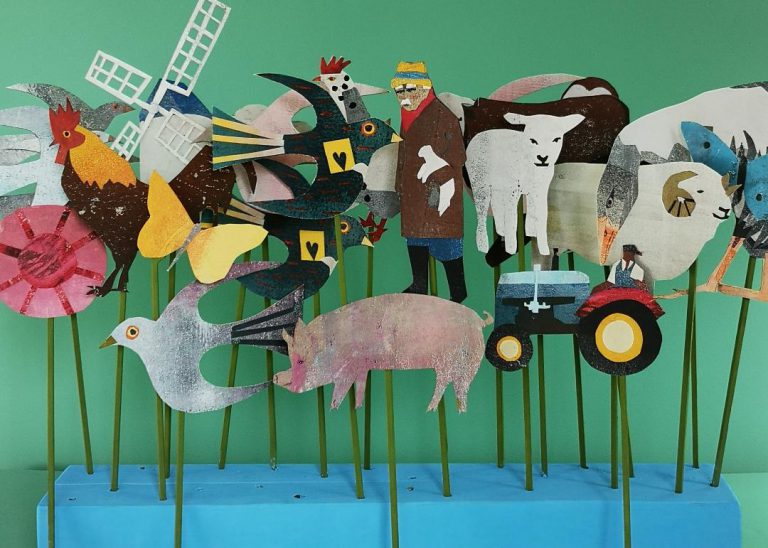 A series of colourful paper puppet figures showing farm animals, vehicles, and rural features