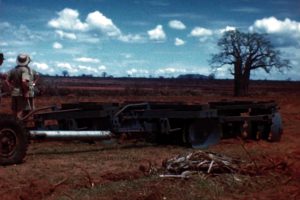 Still from film called 'The Groundnut Scheme at Kongwa' showing people inspecting machinery