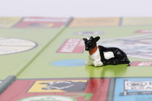 Board and playing piece (detail) from Waddingtons, Grade Up To Elite Cow board game, 1986 (MERL 2010/34)