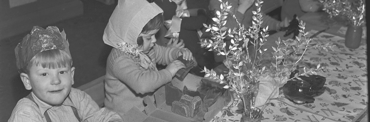 Children at a Christmas table.