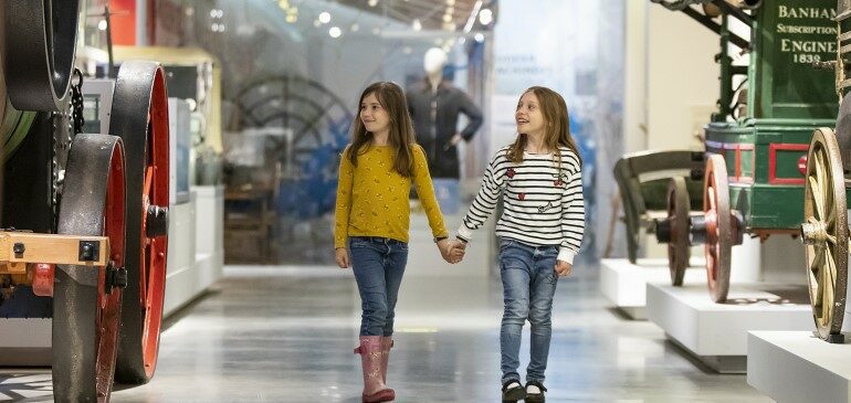 Two girls walking in The MERL galleries