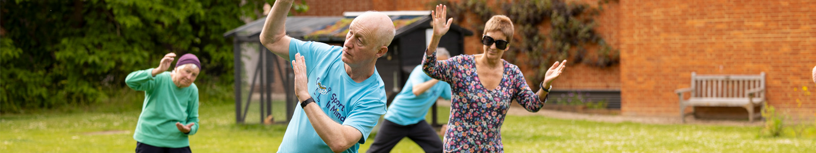 Sport in Mind Tai Chi session taking place in the MERL garden