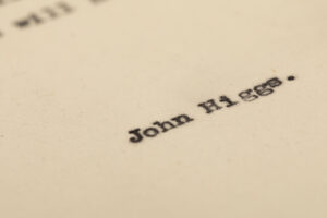Close up of John Higgs' name at the end of a draft, typewritten article by John Higgs entitled 'Making a Museum'