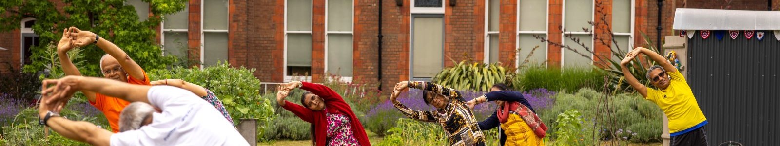 People doing yoga in The MERL garden.