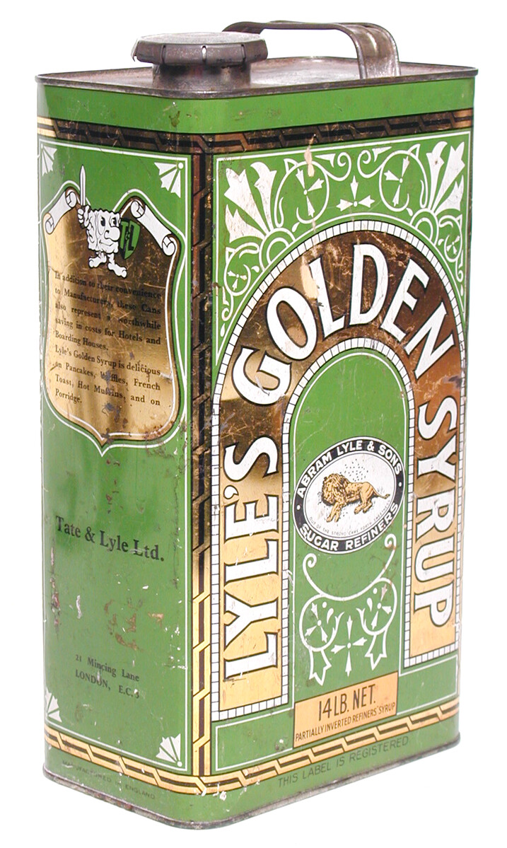 This is a Lyle's golden syrup can with handle and clip lid, made of metal with a design in gold, green and white. It is made to hold 14 lbs of syrup.