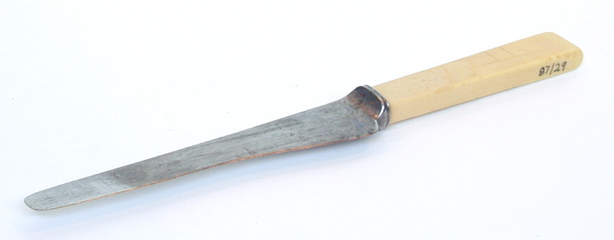 Knife (object name) This is a knife with a steel blade and a handle possibly made from bone. The blade is very worn from use and regular sharpening.