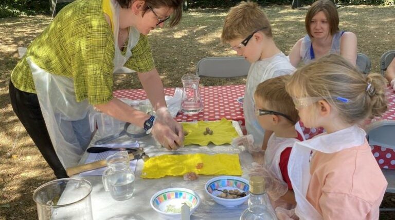 Children learning how to make paper