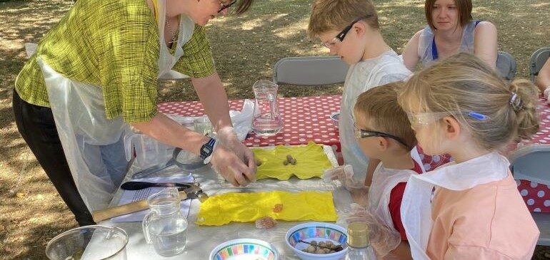 Children learning how to make paper