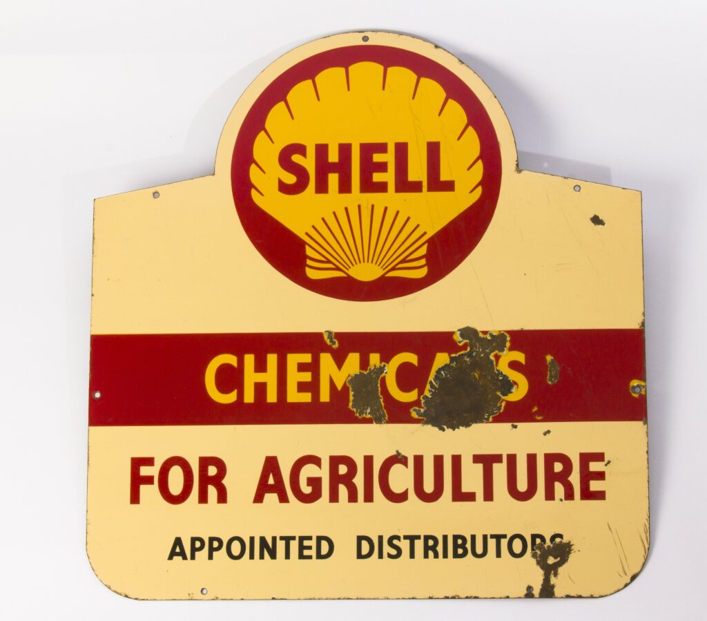 Enamel sign with red and yellow design and scallop shell logo, which reads 'Shell Chemicals for Agriculture'