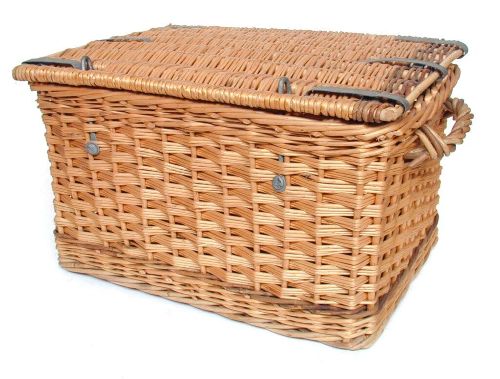 A robust basket of willow and cane, with metal strengtheners, substantial handles, and a lid