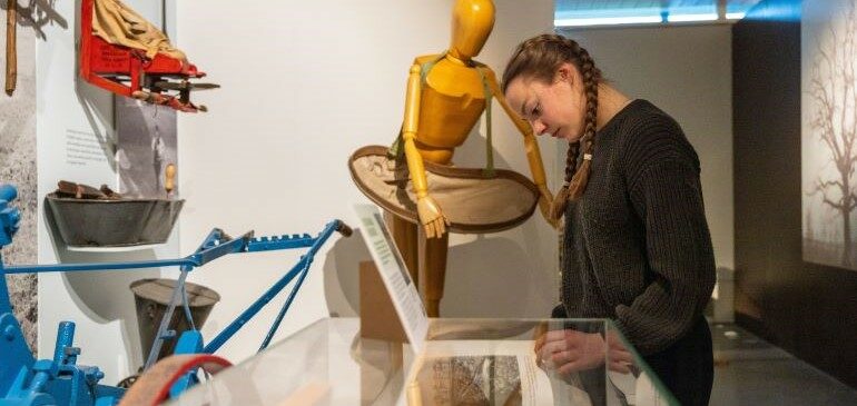 A young person looking at an object in the MERL galleries
