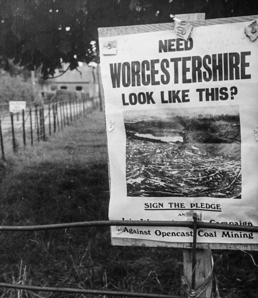Protest sign reading "Need Worcestershire look like this?"