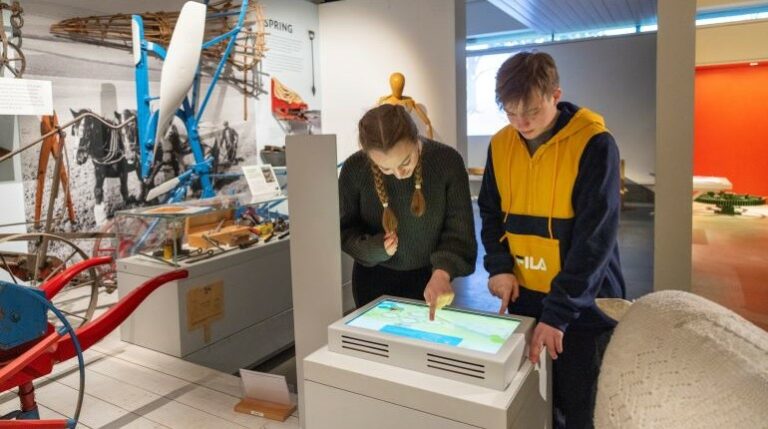 Young people playing an interactive game in the MERL galleries