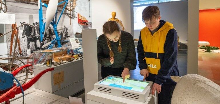 Young people playing an interactive game in the MERL galleries