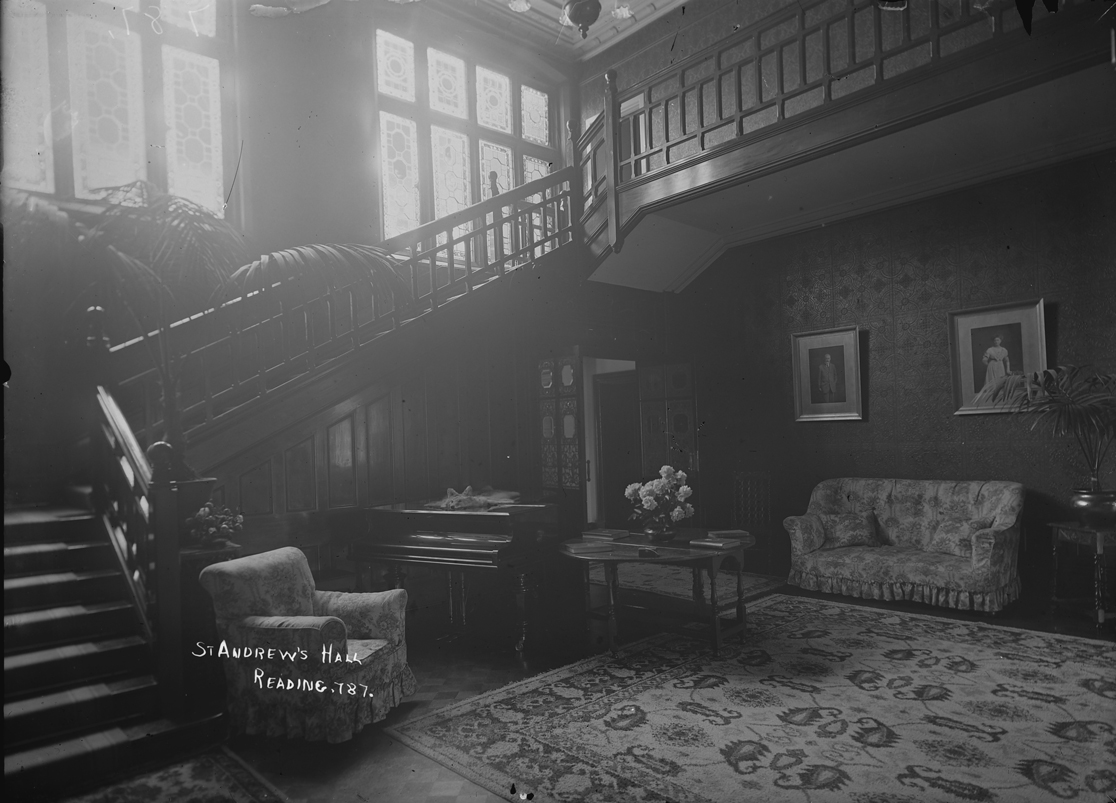 Black and white photograph of the staircase hall at St Andrews when it was used as a sitting room (1880-1939)