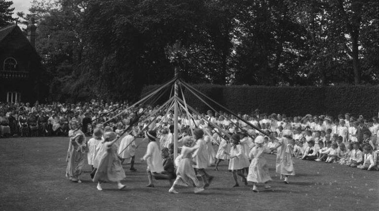 May Day pageant involving school children, dancing around the maypole