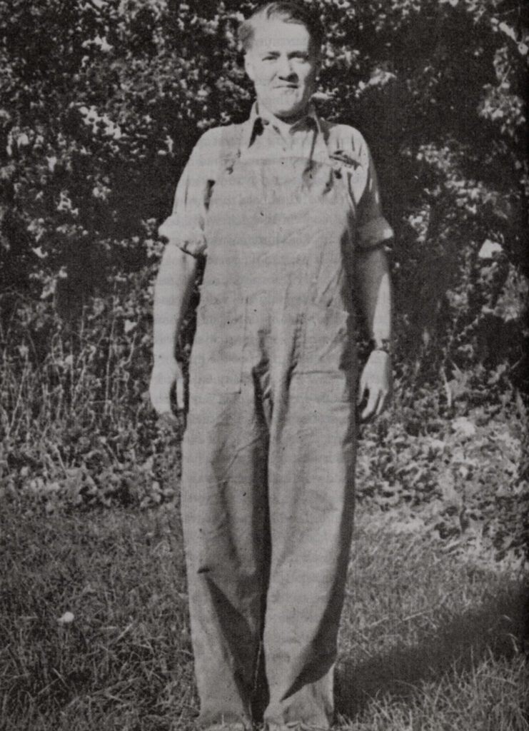 Portrait of Barraud in overalls.