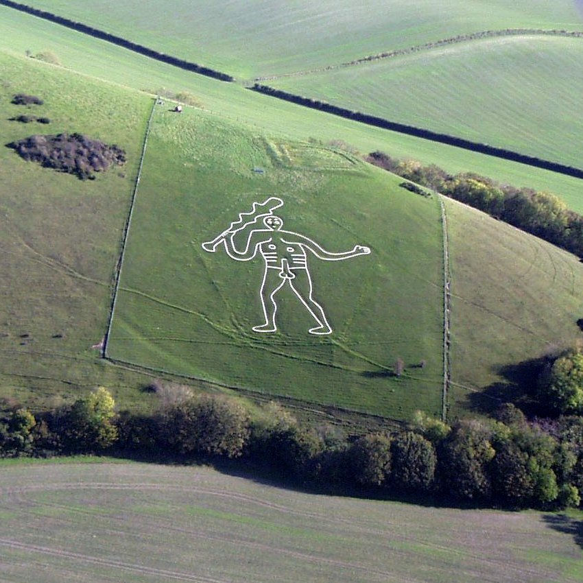 A hillside, featuring a figure of a large man, holding a club