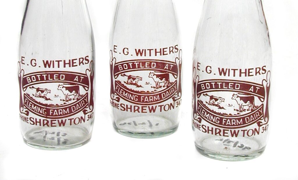 three glass pint milk bottles