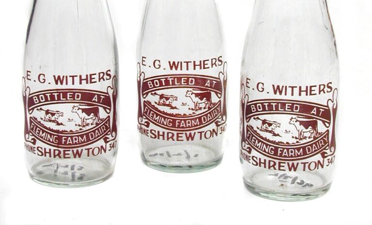 three glass pint milk bottles