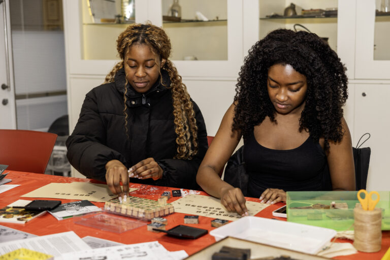 2 women enjoying a craft in the MERL Studio at a Late.