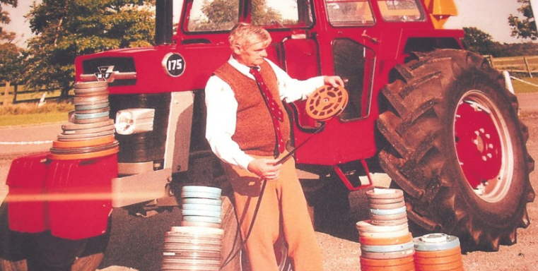 Richard Watts with a tractor and film reels