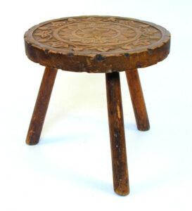 three legged wooden stool