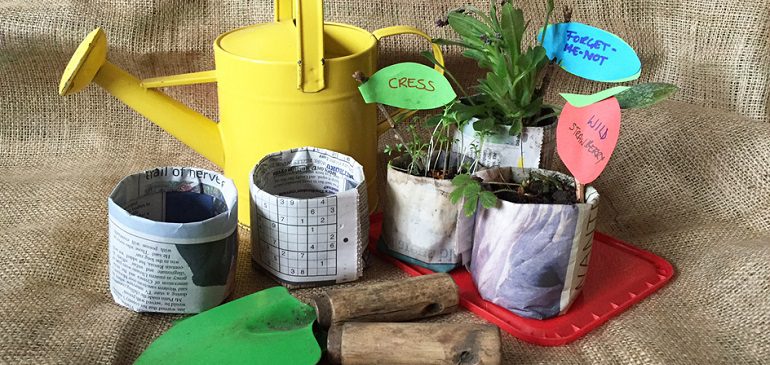 Paper plant pots, watering can and trowels