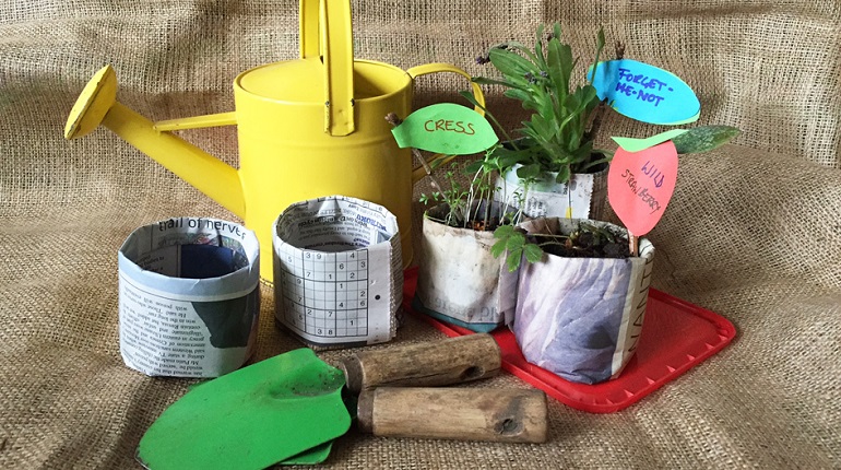 Paper plant pots, watering can and trowels