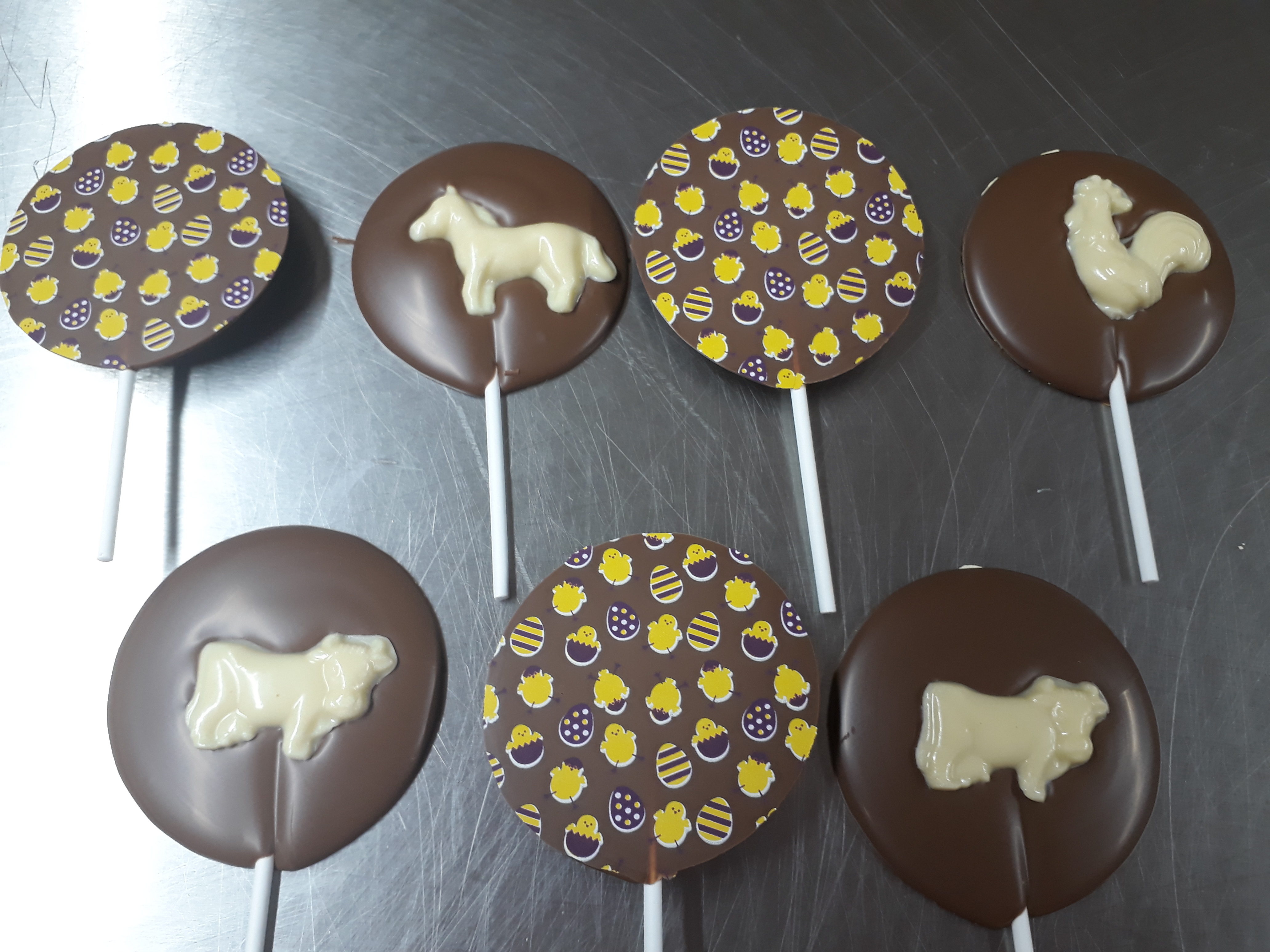 Milk chocolate lollipops with white chocolate farm animal design