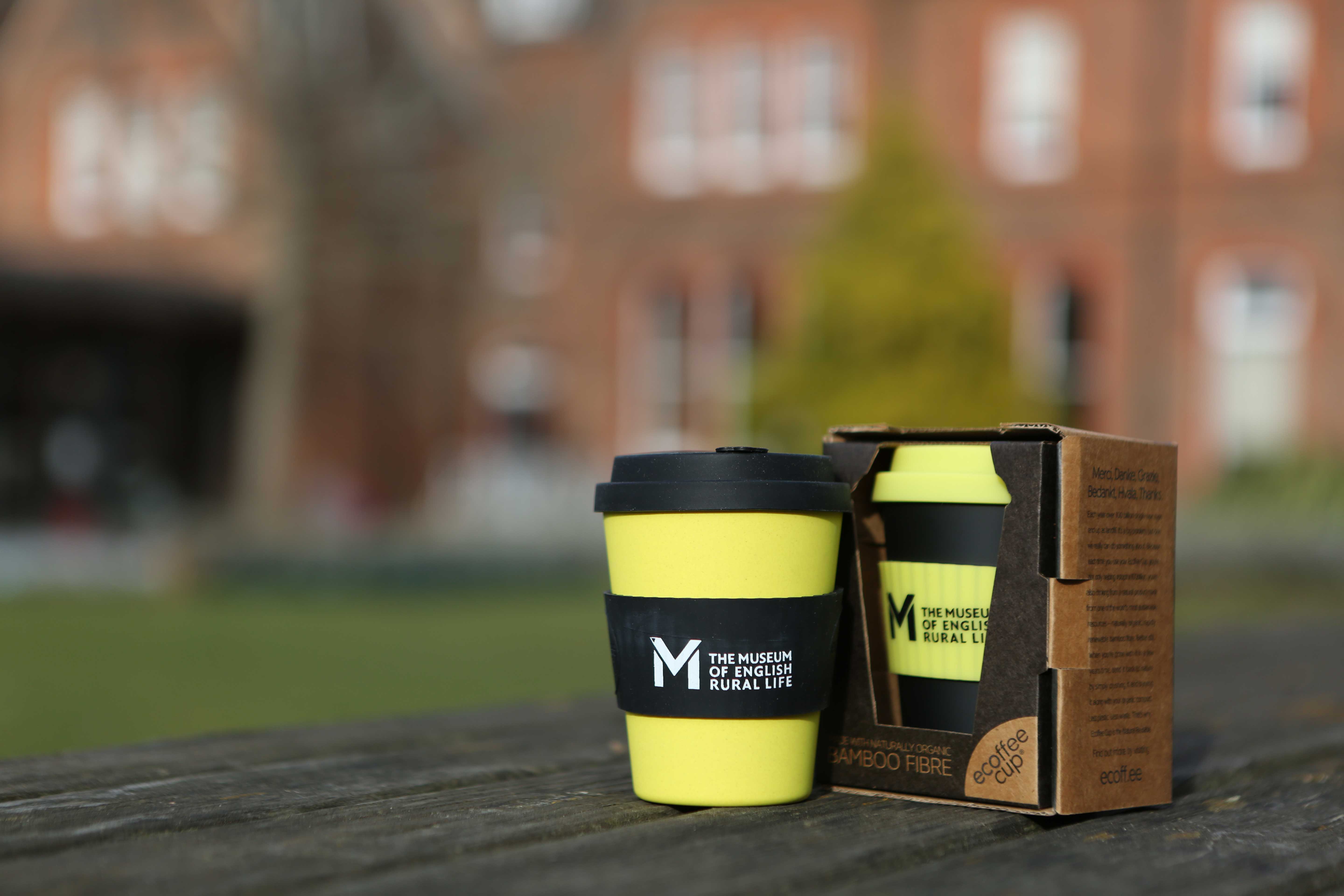 Yellow and black bamboo keep cups featuring the MERL logo