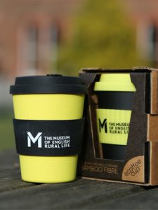 yellow and black bamboo keep cups featuring the MERL logo, available in the MERL cafe