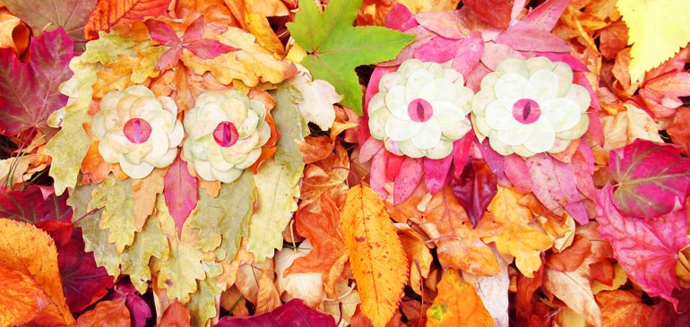 a picture of two owls made from autumn leaves for second sunday craft drop-in