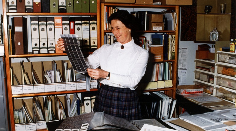 Jill Betts looking at slides.