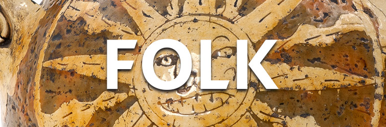 An close-up of a slipware harvest jug coloured brown and yellow, with the design of a smiling sun on the front and overlaid white text 'Folk'.