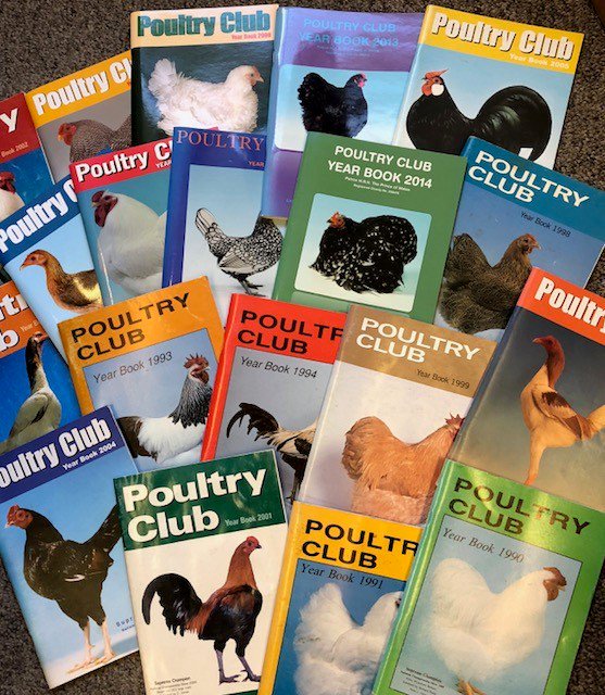 A photo of Poultry Club magazines spread across the floor.