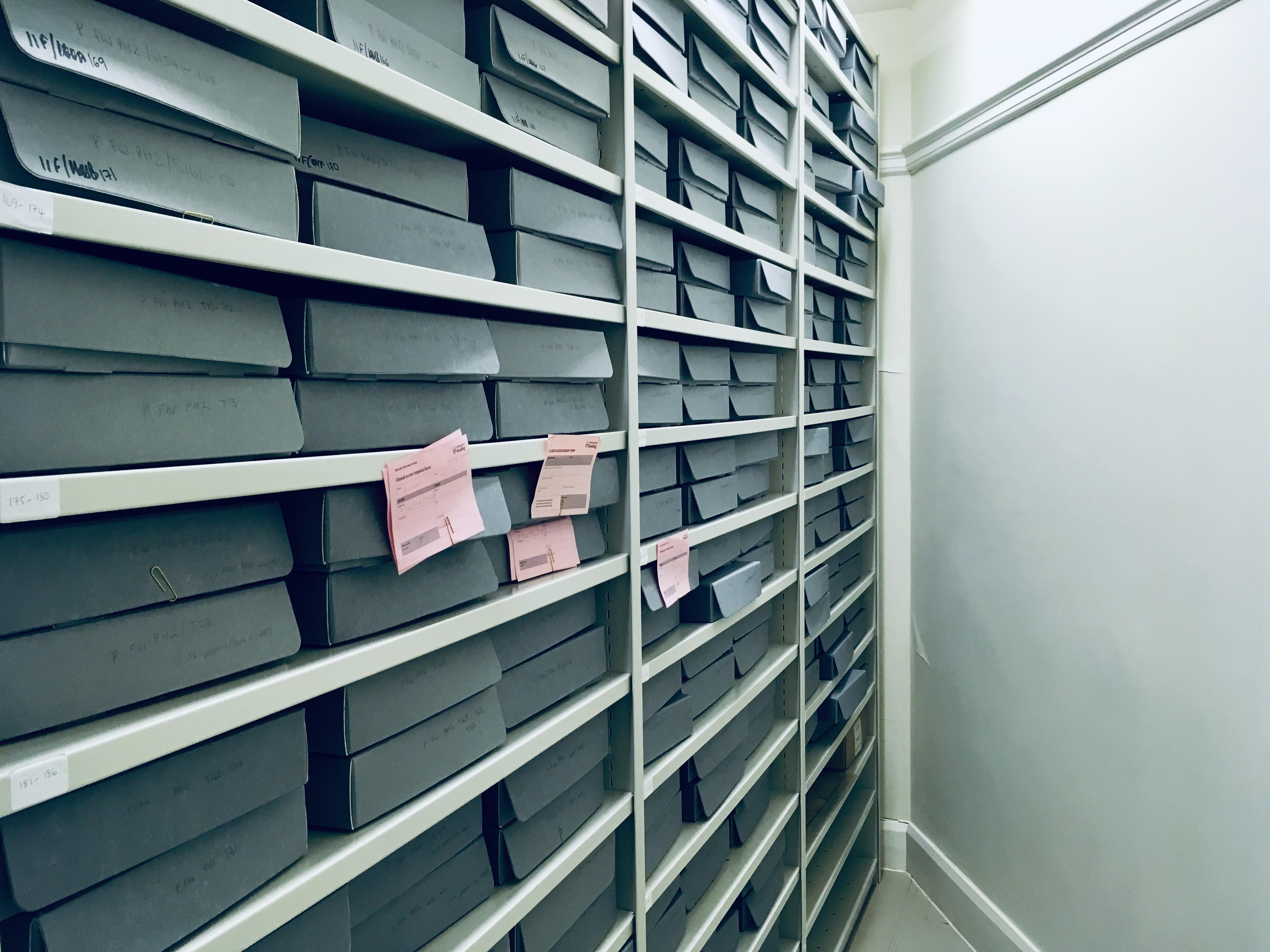 Image of a row of shelves holding archive boxes