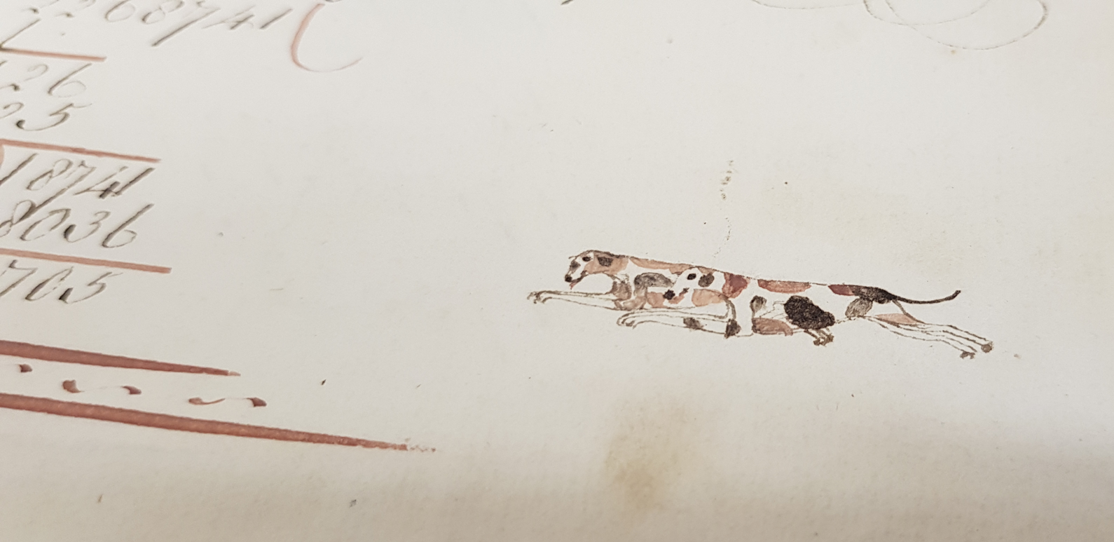 Two dogs running, drawn on a piece of paper